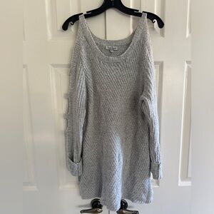 Size medium grey sweater with cut outs on sleeve.